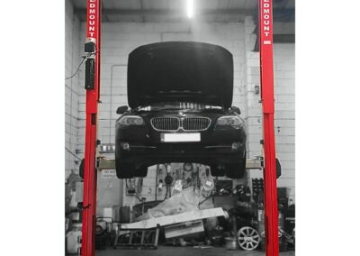 A BMW on our 5500kg clear floor gantry style 2 post lift